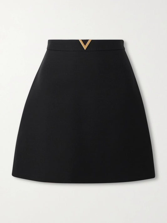 Image of a model wearing Skirts. Product name - Embellished Wool And Silk-blend Crepe Mini Skirt in Black colour by brand - Valentino Garavani