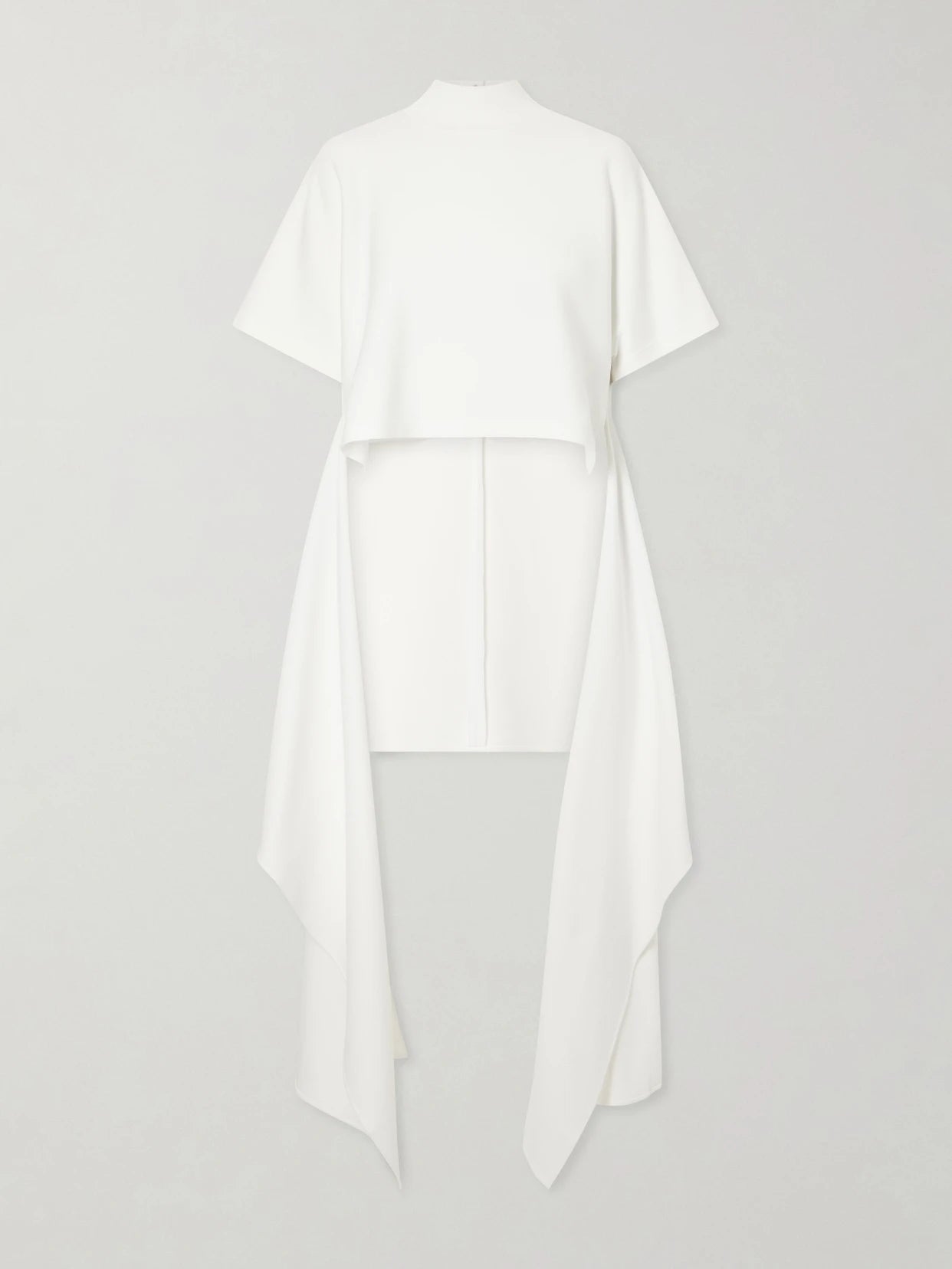 Image of a model wearing Tops. Product name - Asymmetric Cotton-blend Jersey T-shirt in White colour by brand - Alaïa