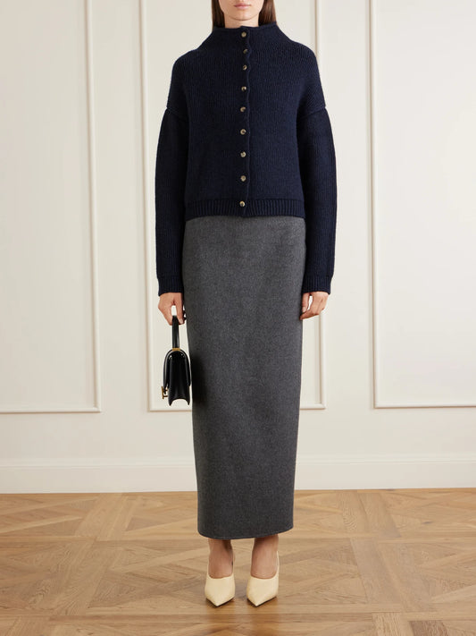 Image of a model wearing Skirts. Product name - Loxley Darted Wool, Silk And Cashmere-blend Felt Midi Skirt in Charcoal colour by brand - KHAITE