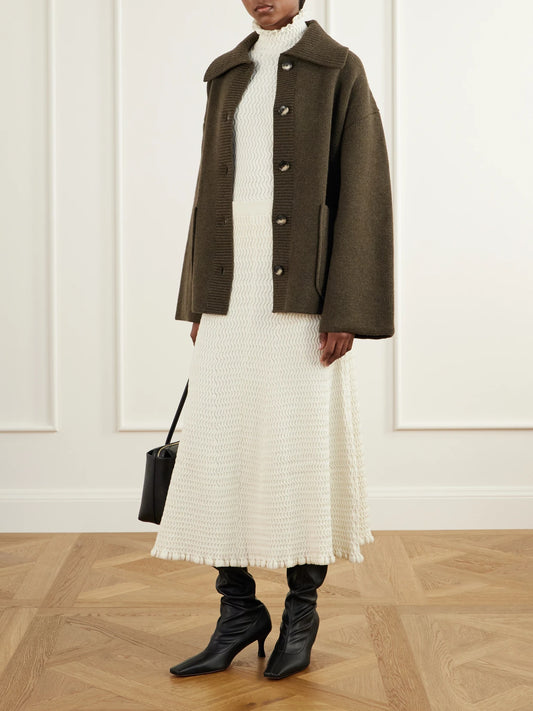 Image of a model wearing Skirts. Product name - Magnolia Cable-knit Cotton-blend Midi Skirt in Cream colour by brand - Proenza Schouler White Label