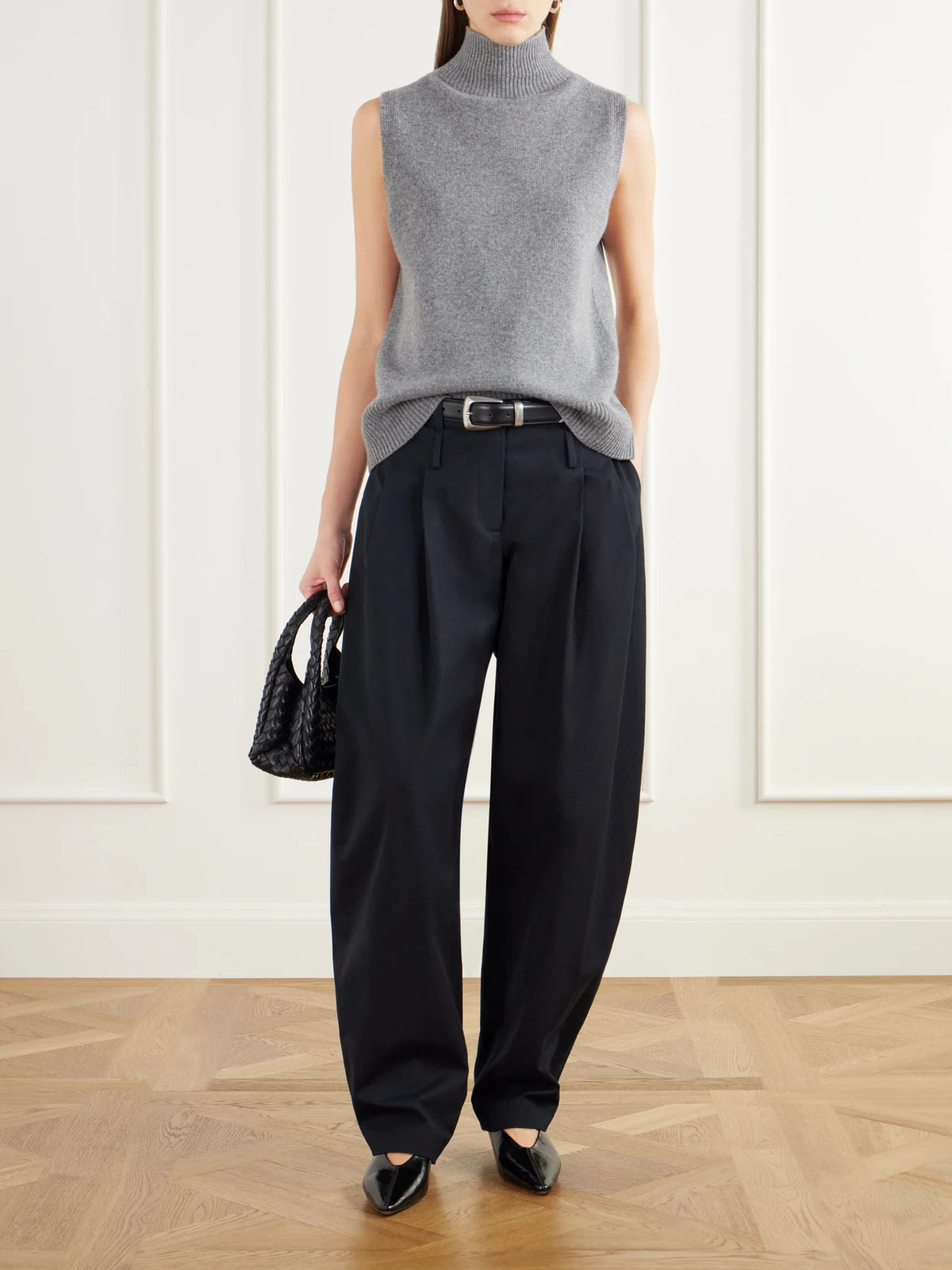 Image of a model wearing Pants. Product name - The Dean Cotton-canvas Barrel-leg Pants in Black colour by brand - Brandon Maxwell