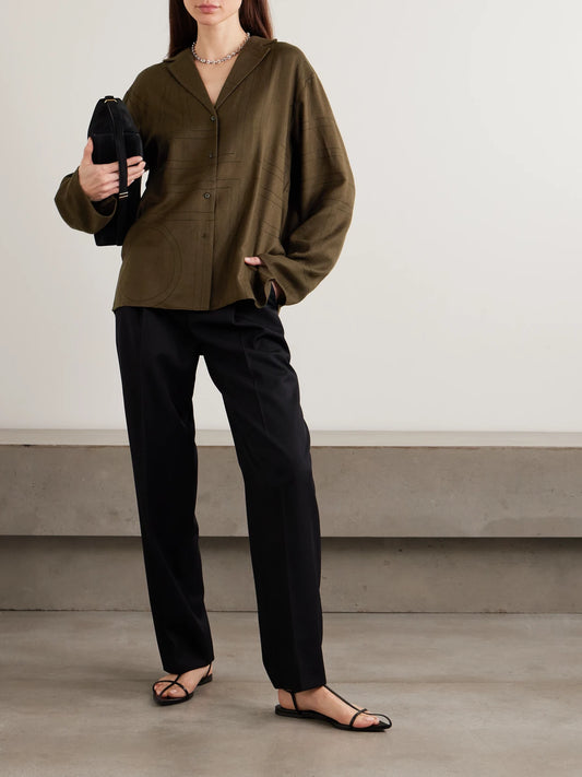 Image of a model wearing Tops. Product name - Embroidered Modal-twill Shirt in Dark brown colour by brand - TOTEME