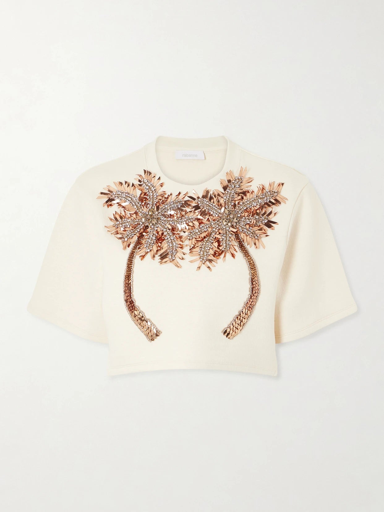 Image of a model wearing Tops. Product name - Cropped Crystal-embellished Embroidered Jersey T-shirt in Ivory colour by brand - RABANNE