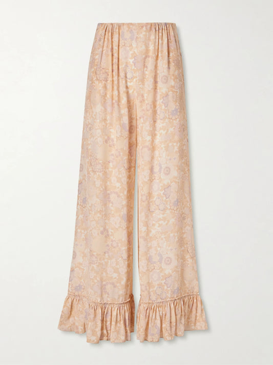Image of a model wearing Pants. Product name - Ruffled Floral-print Silk-charmeuse Wide-leg Pants in Pink colour by brand - Chloé