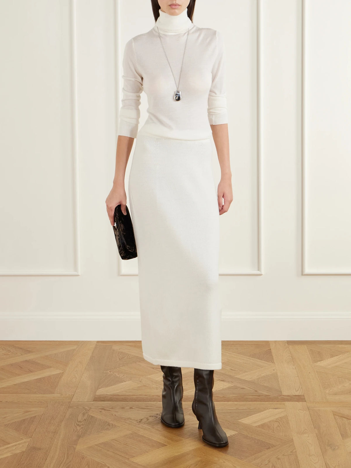 Image of a model wearing Skirts. Product name - Daria Wool And Cashmere-blend Midi Skirt in White colour by brand - THE PARK