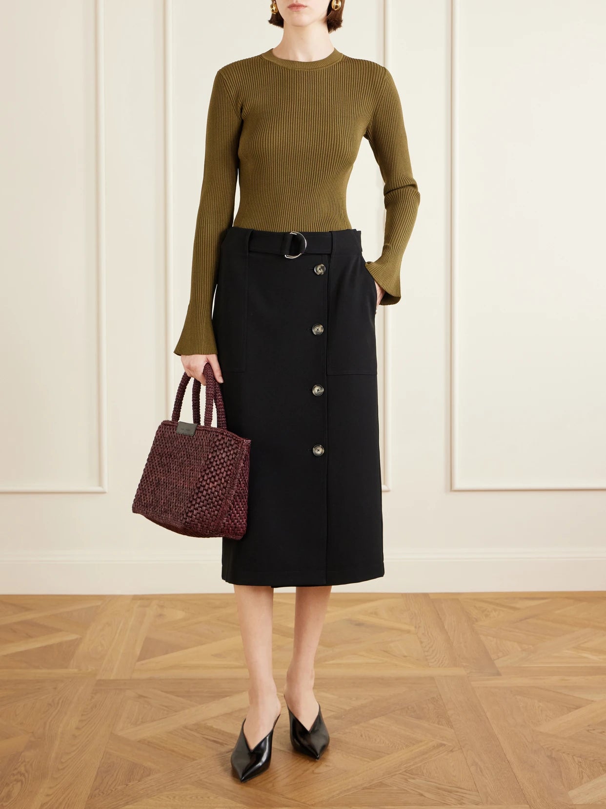 Image of a model wearing Outerwear. Product name - Nir Ribbed-knit Top in Leaf green colour by brand - Proenza Schouler