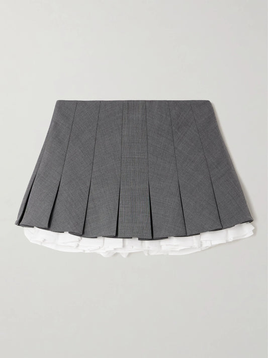 Image of a model wearing Skirts. Product name - Layered Pleated Cotton Poplin-trimmed Grain De Poudre Mini Skirt in Gray colour by brand - SHUSHU/TONG