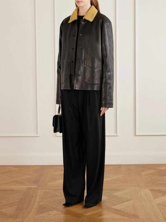 Image of a model wearing Pants. Product name - August Pleated Wool-blend Flannel Straight-leg Pants in Black, Gray colour by brand - KHAITE