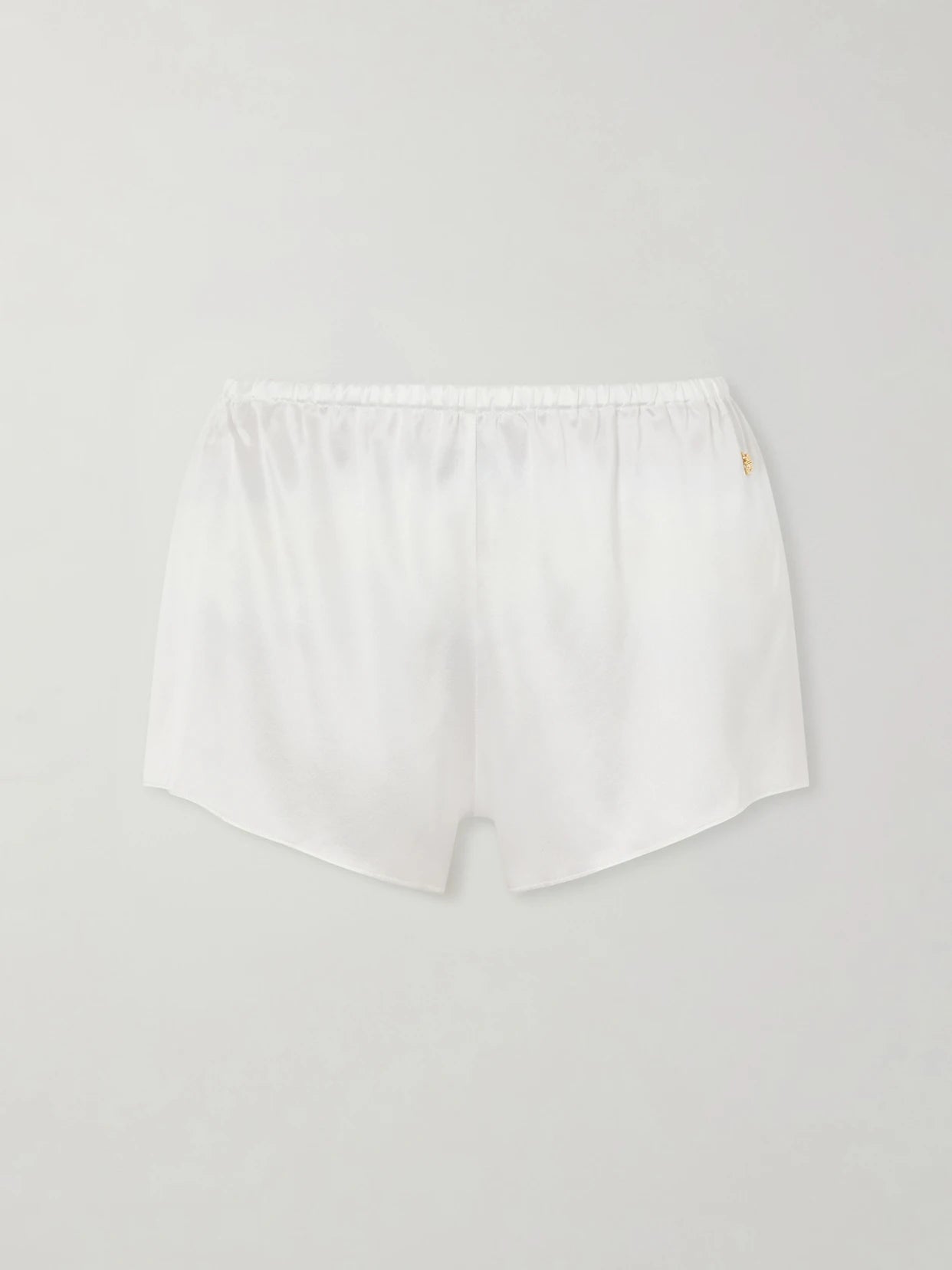 Image of a model wearing Shorts. Product name - Lane Silk-blend Satin Shorts in Ivory colour by brand - ÉTERNE
