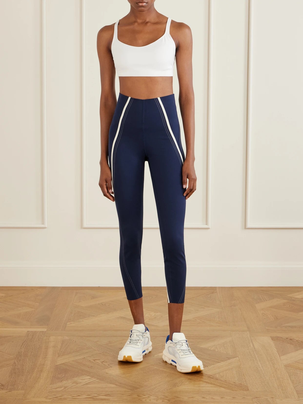 Image of a model wearing Pants. Product name - Striped Ultralu Leggings in Navy colour by brand - lululemon