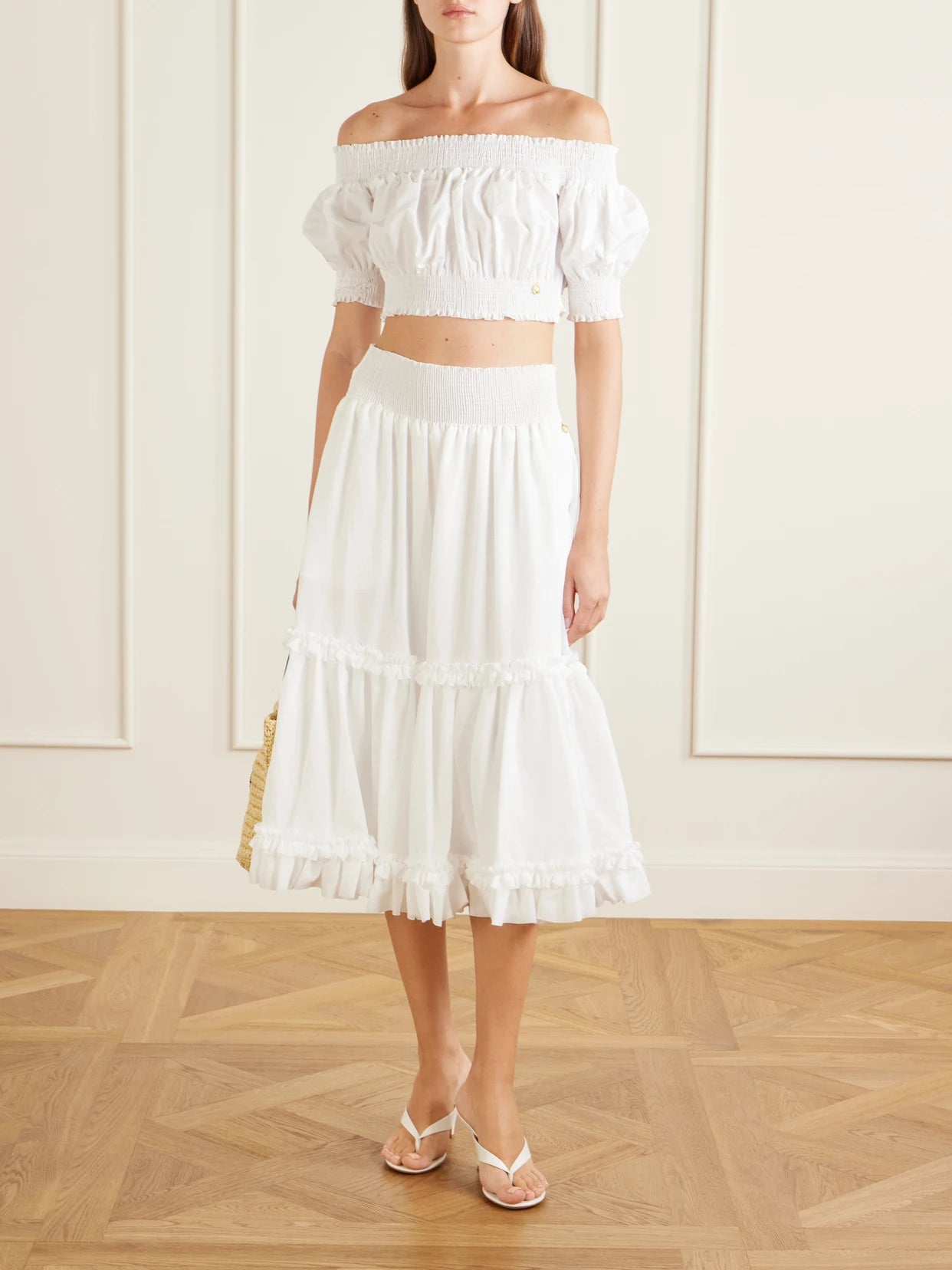 Image of a model wearing Tops. Product name - Embellished Cropped Off-the-shoulder Cotton-poplin Top in White colour by brand - Balmain