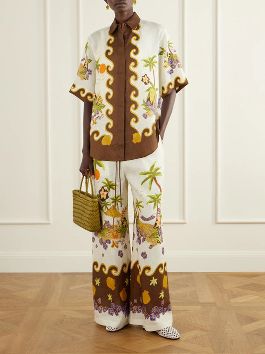 Image of a model wearing Tops. Product name - Island Cove Printed Linen Shirt in Cream colour by brand - ALÉMAIS