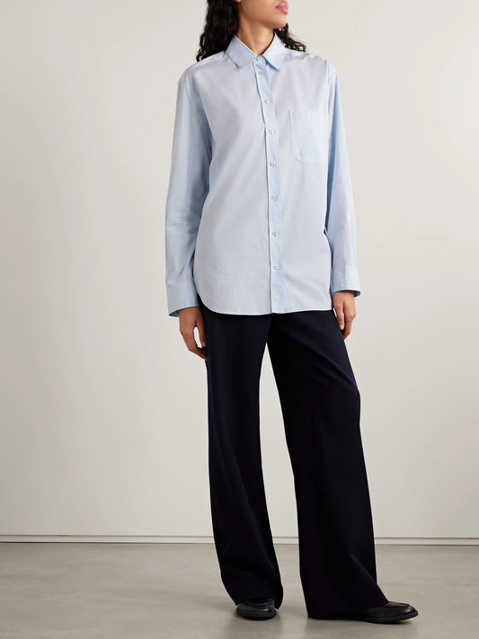 Image of a model wearing Tops. Product name - Gavina Sea Island Cotton Shirt in Light blue colour by brand - The Row