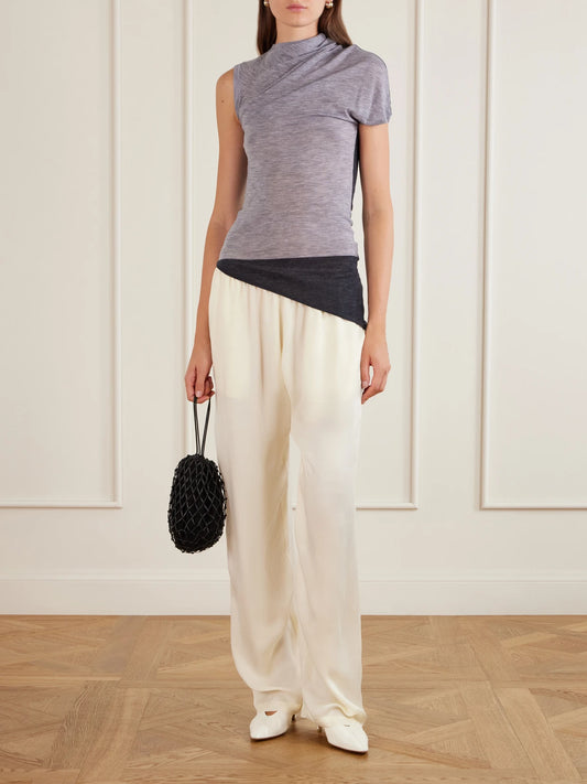 Image of a model wearing Tops. Product name - Willla Asymmetric Wool Tank in Gray colour by brand - Sharon Wauchob