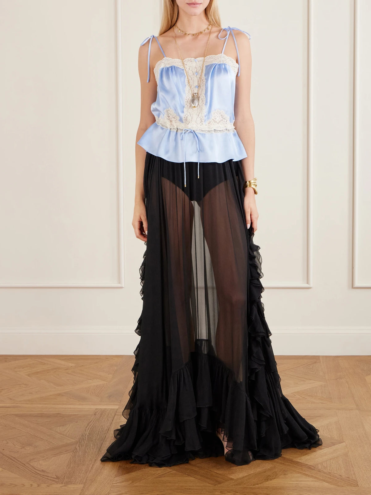 Image of a model wearing Skirts. Product name - Ruffled Silk-crepon Maxi Skirt in Black colour by brand - Chloé