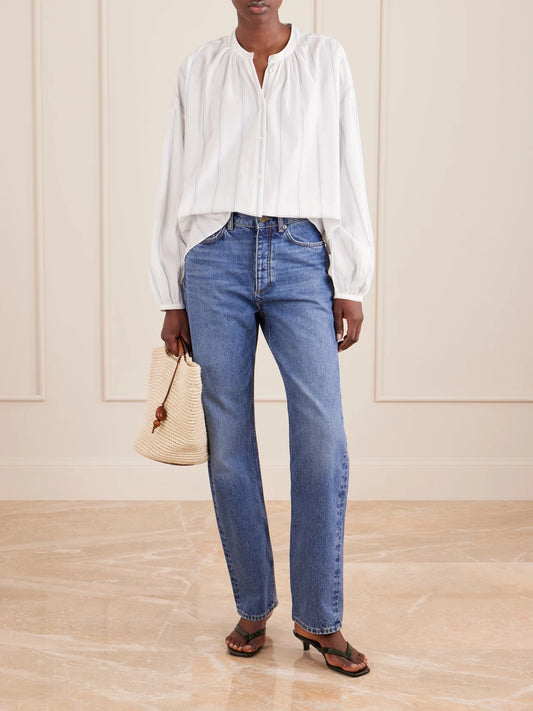 Image of a model wearing Tops. Product name - Cilla Striped Organic Cotton Shirt in White colour by brand - SKALL
