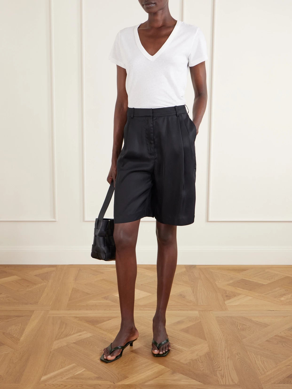 Image of a model wearing Tops. Product name - Laura Cotton-jersey T-shirt in White colour by brand - LESET