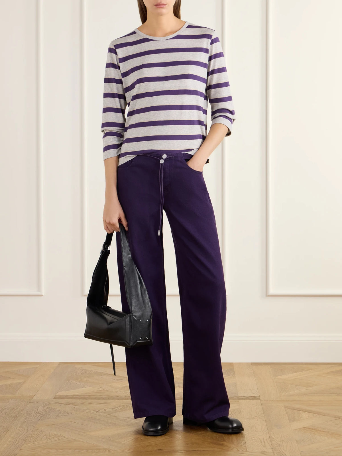 Image of a model wearing Tops. Product name - Striped Cotton-jersey T-shirt in Gray colour by brand - Still Here