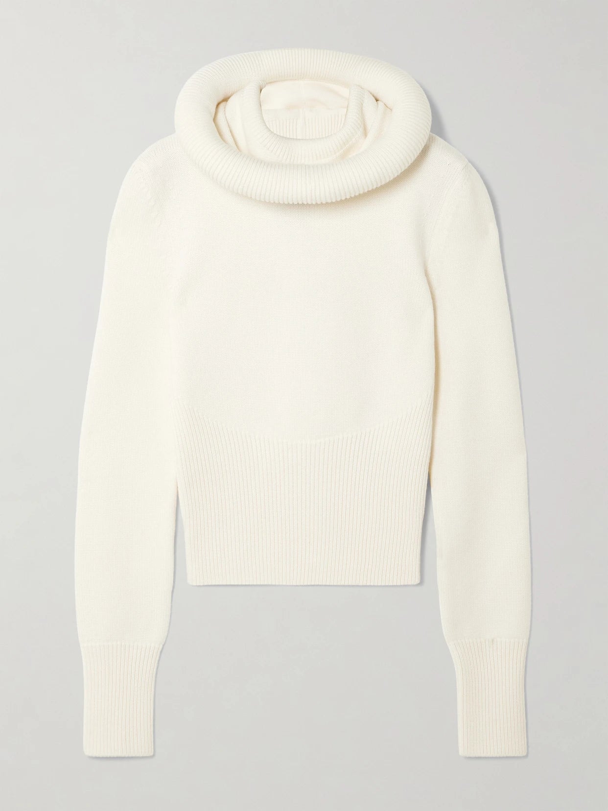 Image of a model wearing Outerwear. Product name - Wool Hooded Sweater in White colour by brand - Alaïa