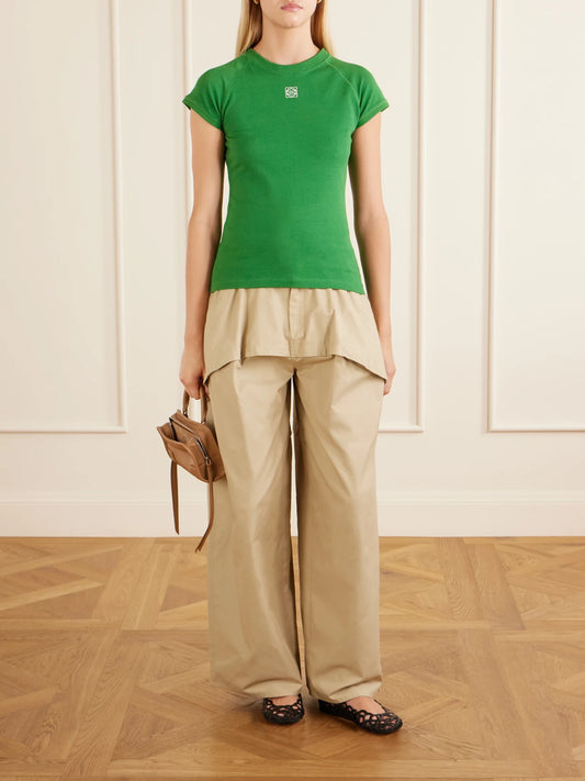 Image of a model wearing Tops. Product name - Anagram Embroidered Cotton-blend Jersey T-shirt in Green colour by brand - LOEWE