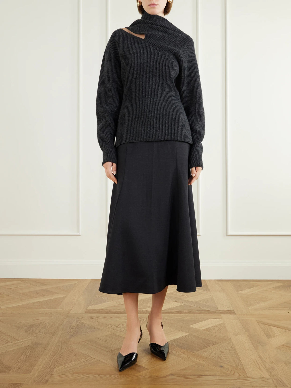 Image of a model wearing Outerwear. Product name - Cut-out Wool And Cashmere-blend Sweater in Dark gray colour by brand - Carolina Herrera