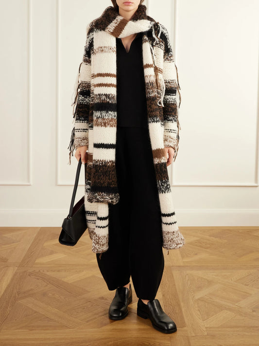 Image of a model wearing Outerwear. Product name - Double-knit Merino Wool, Alpaca And Pima Cotton-blend Sweater in Black colour by brand - Lauren Manoogian