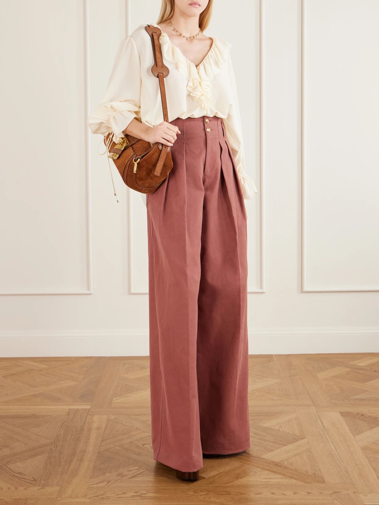 Image of a model wearing Tops. Product name - Ruffled Silk Crepe De Chine Blouse in White colour by brand - Chloé