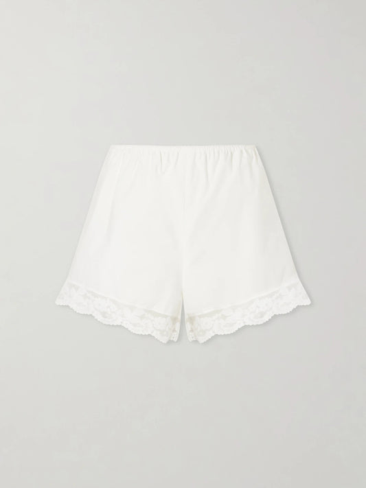 Image of a model wearing Shorts. Product name - Cristina Lace-trimmed Cotton-poplin Shorts in White colour by brand - Faithfull