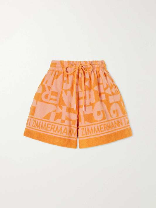 Image of a model wearing Shorts. Product name - Solstice Jacquard-knit Cotton-terry Shorts in Orange colour by brand - Zimmermann