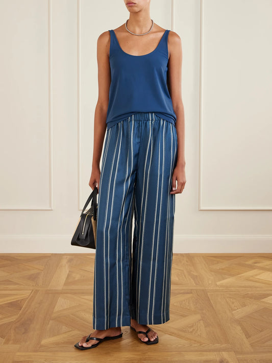 Image of a model wearing Tops. Product name - Anae Stretch-jersey Tank in Navy colour by brand - Eres