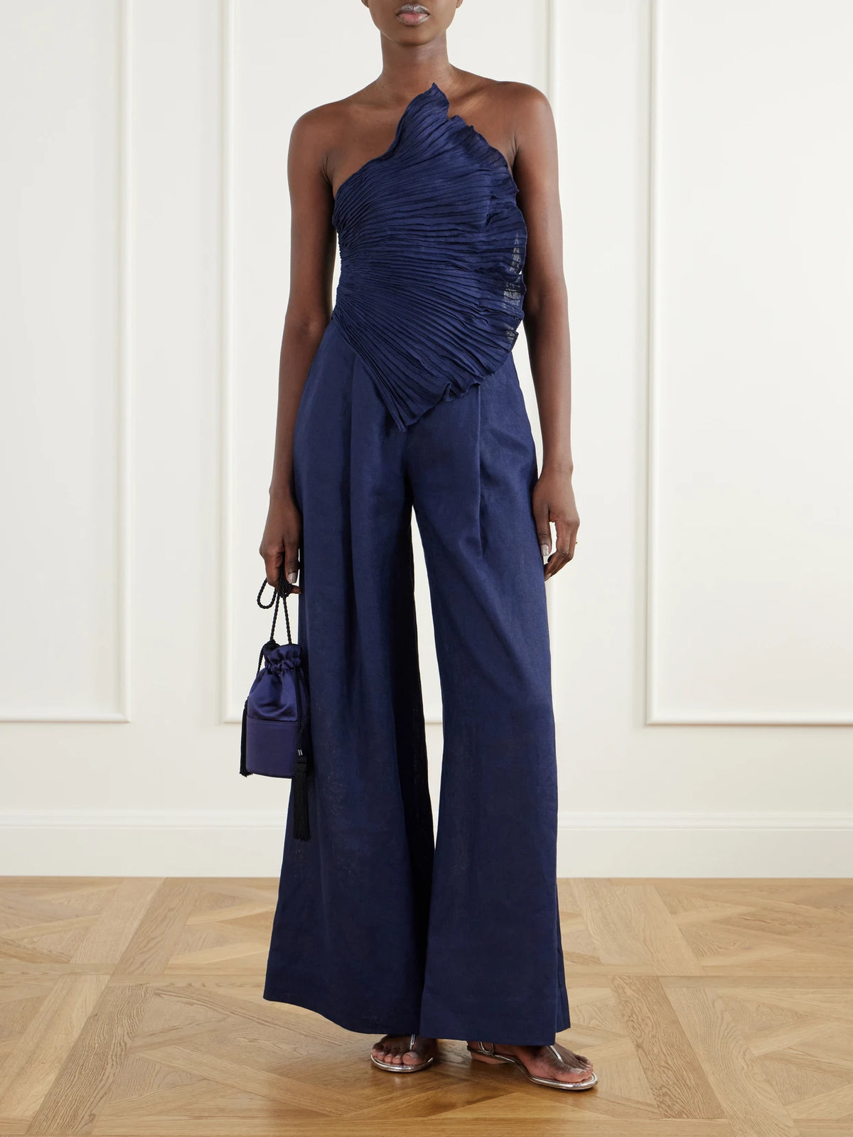 Image of Bodysuits. Product name - Ainma Pleated Linen-woven Jumpsuit in Navy colour by brand - Andres Otalora