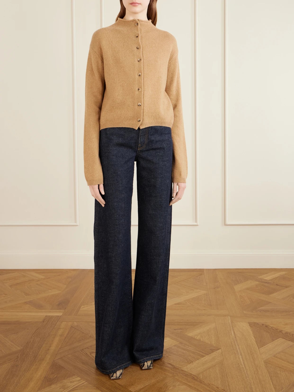 Image of a model wearing Outerwear. Product name - Annora Wool And Cashmere-blend Turtleneck Cardigan in Beige colour by brand - KHAITE