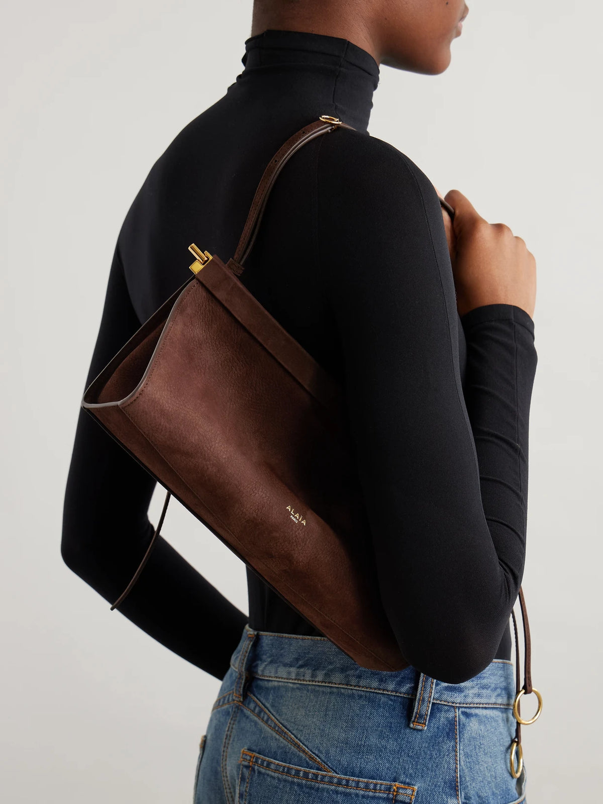 Image of Bags. Product name - Le Click E/w Medium Nubuck Shoulder Bag in Brown colour by brand - Alaïa