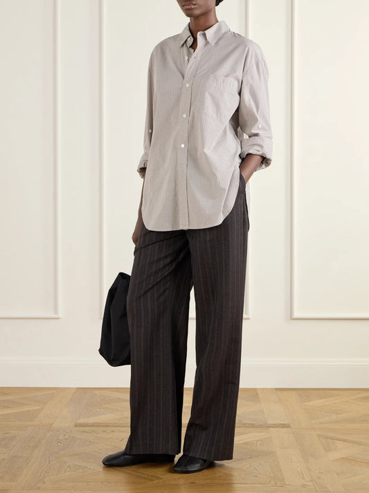 Image of a model wearing Pants. Product name - Primary Striped Wool Straight-leg Pants in Dark brown colour by brand - MFPEN