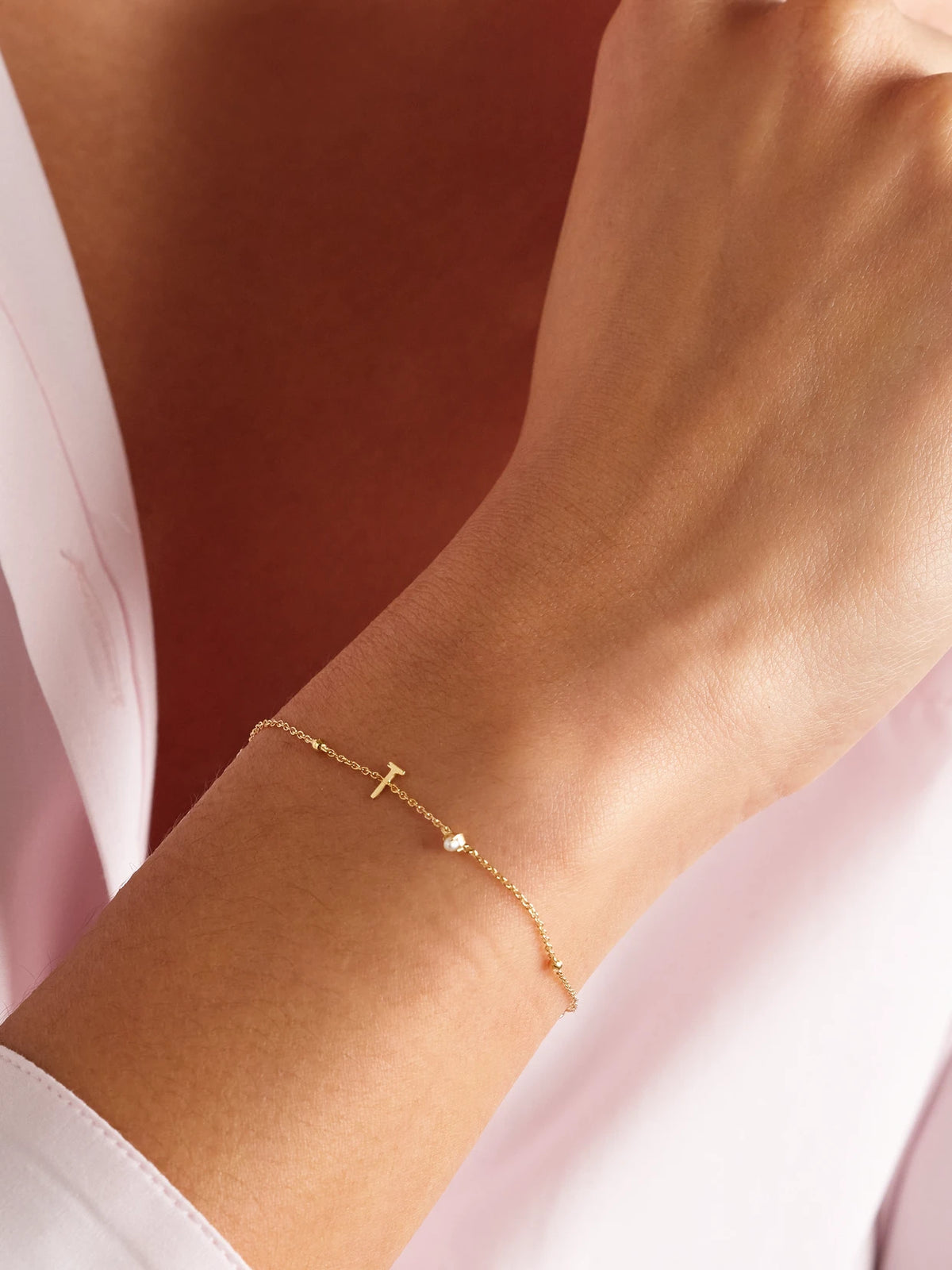 Image of Bracelets. Product name - Initial 14-karat Gold Pearl Bracelet in Y colour by brand - STONE AND STRAND
