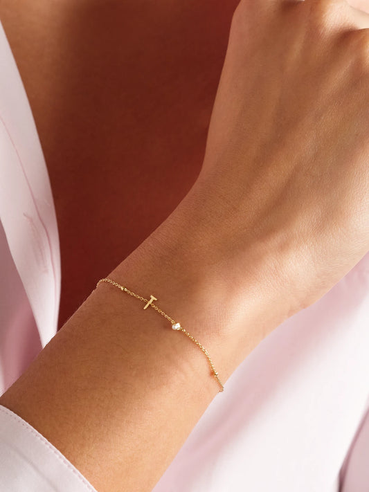 Image of Bracelets. Product name - Initial 14-karat Gold Pearl Bracelet in Y colour by brand - STONE AND STRAND