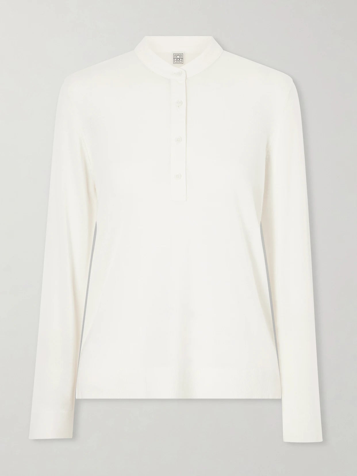 Image of a model wearing Outerwear. Product name - Wool And Silk-blend Sweater in Off-white colour by brand - TOTEME