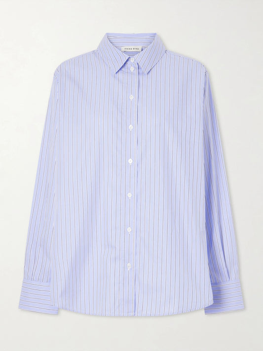 Image of a model wearing Tops. Product name - Essie Striped Cotton-poplin Shirt in Blue colour by brand - Anine Bing