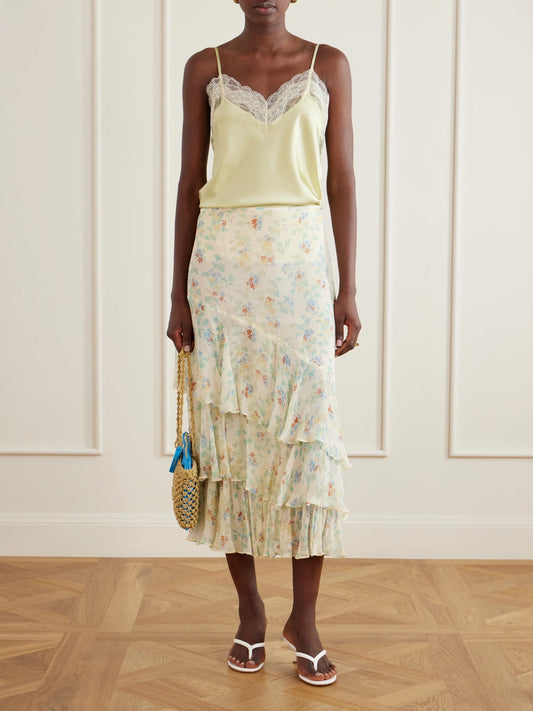 Image of a model wearing Skirts. Product name - Meadow Floral-print Crepon-silk Midi Skirt in Cream colour by brand - Ulla Johnson