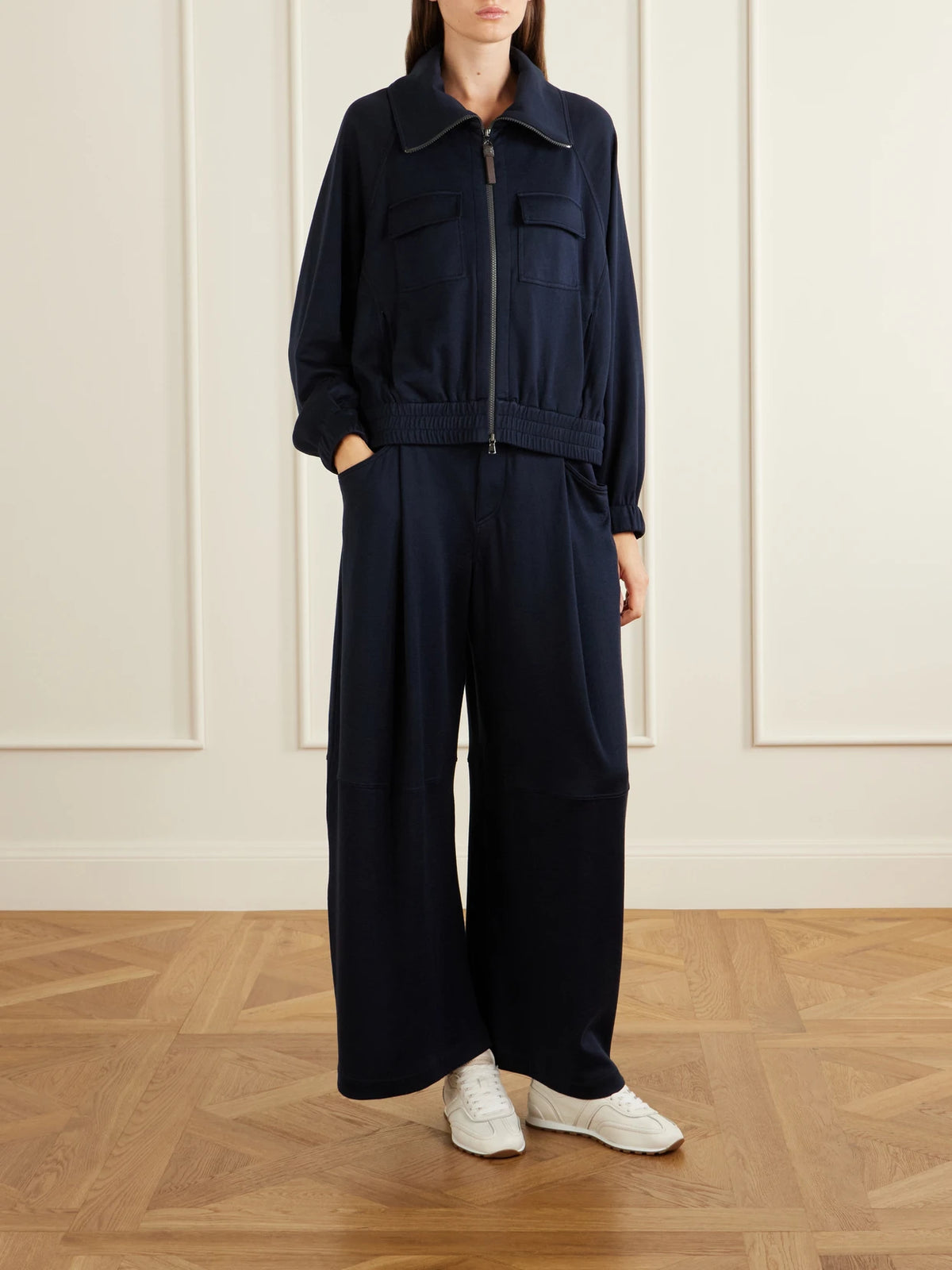 Image of a model wearing Pants. Product name - Cotton Wide-leg Pants in Navy colour by brand - Brunello Cucinelli