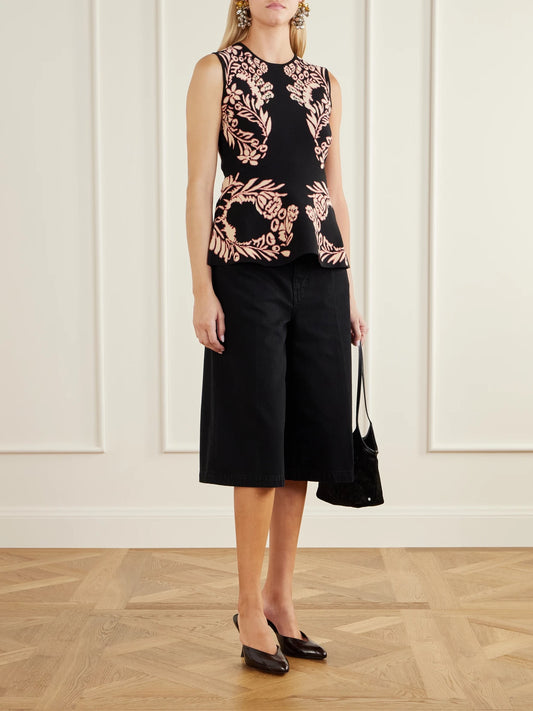 Image of a model wearing Shorts. Product name - The Rowan Embellished Denim Shorts in Black colour by brand - Ulla Johnson