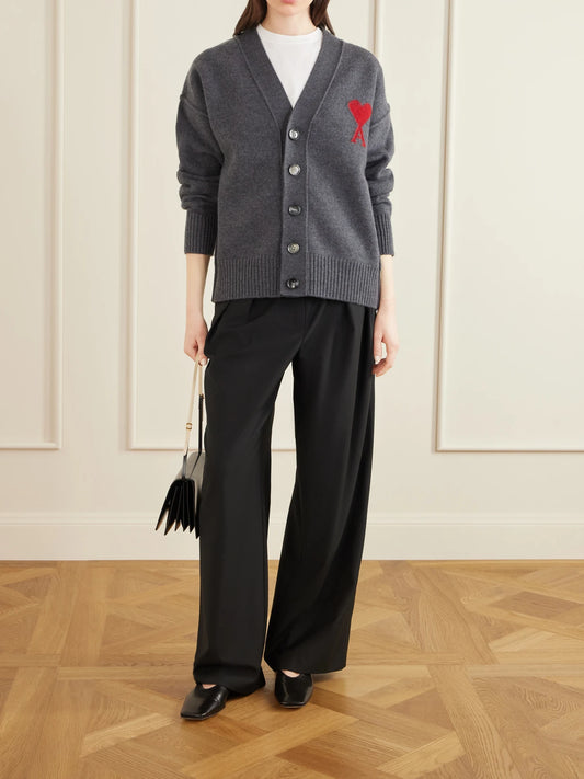 Image of a model wearing Outerwear. Product name - + Net Sustain Adc Intarsia Wool Cardigan in Gray colour by brand - AMI PARIS