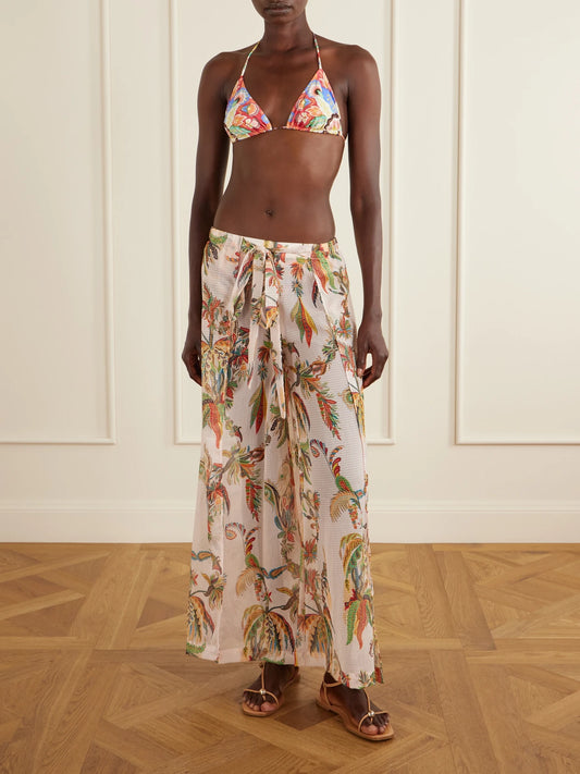 Image of a model wearing Pants. Product name - Belted Tiered Paisley And Floral-print Satin Wide-leg Pants in Pink colour by brand - Etro