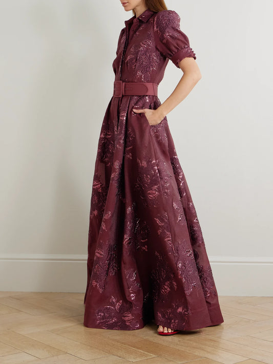 Image of Dresses. Product name - Arlette Belted Metallic Cloqué Gown in Burgundy colour by brand - Rebecca Vallance