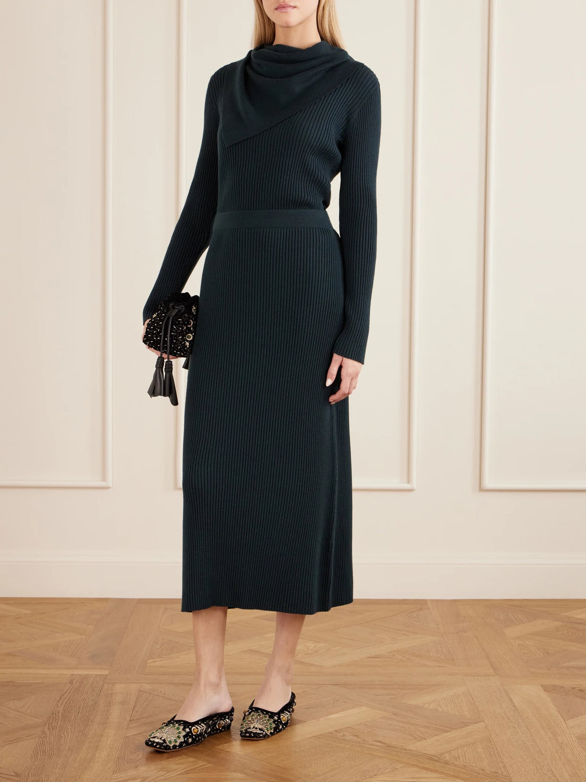 Image of a model wearing Skirts. Product name - Valiant Knitted Wool Midi Skirt in Green colour by brand - Zimmermann