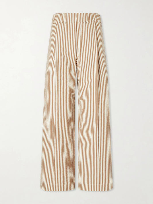 Image of a model wearing Pants. Product name - Cropped Pleated Striped Cotton-blend Wide-leg Pants in Beige colour by brand - Brunello Cucinelli