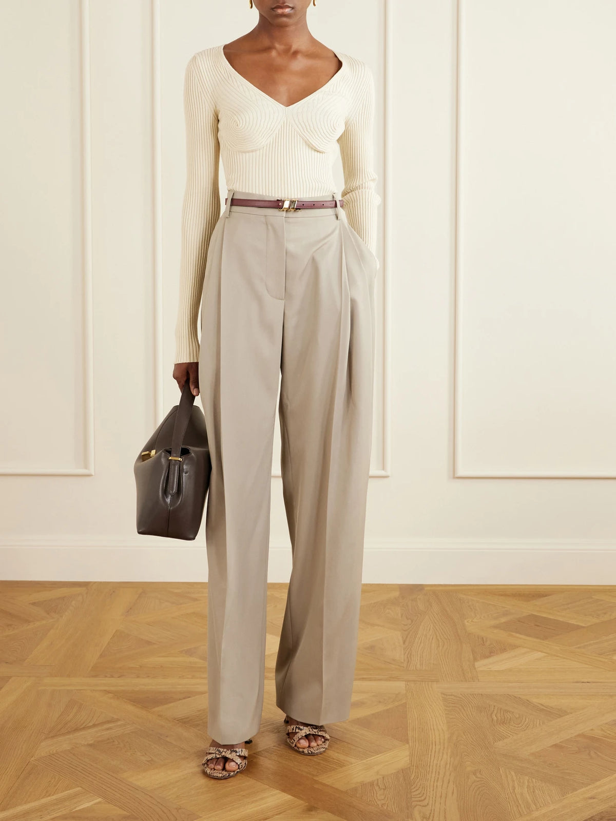 Image of a model wearing Outerwear. Product name - Ribbed Cotton-blend Sweater in Ivory colour by brand - Stella McCartney