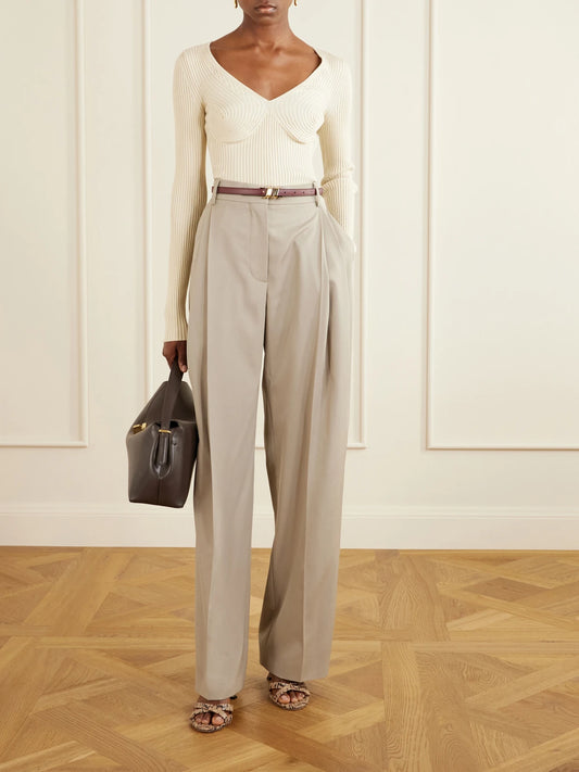 Image of a model wearing Outerwear. Product name - Ribbed Cotton-blend Sweater in Ivory colour by brand - Stella McCartney