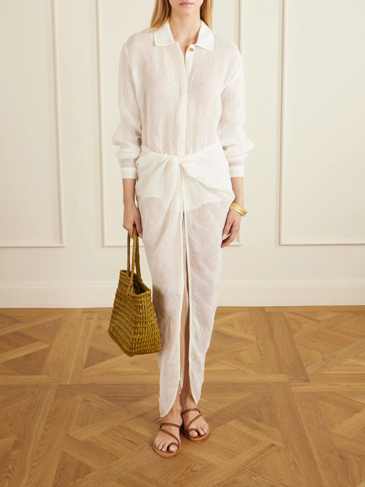 Image of a model wearing Skirts. Product name - Qaraya Light Linen Pareo Skirt in White colour by brand - Le Kasha