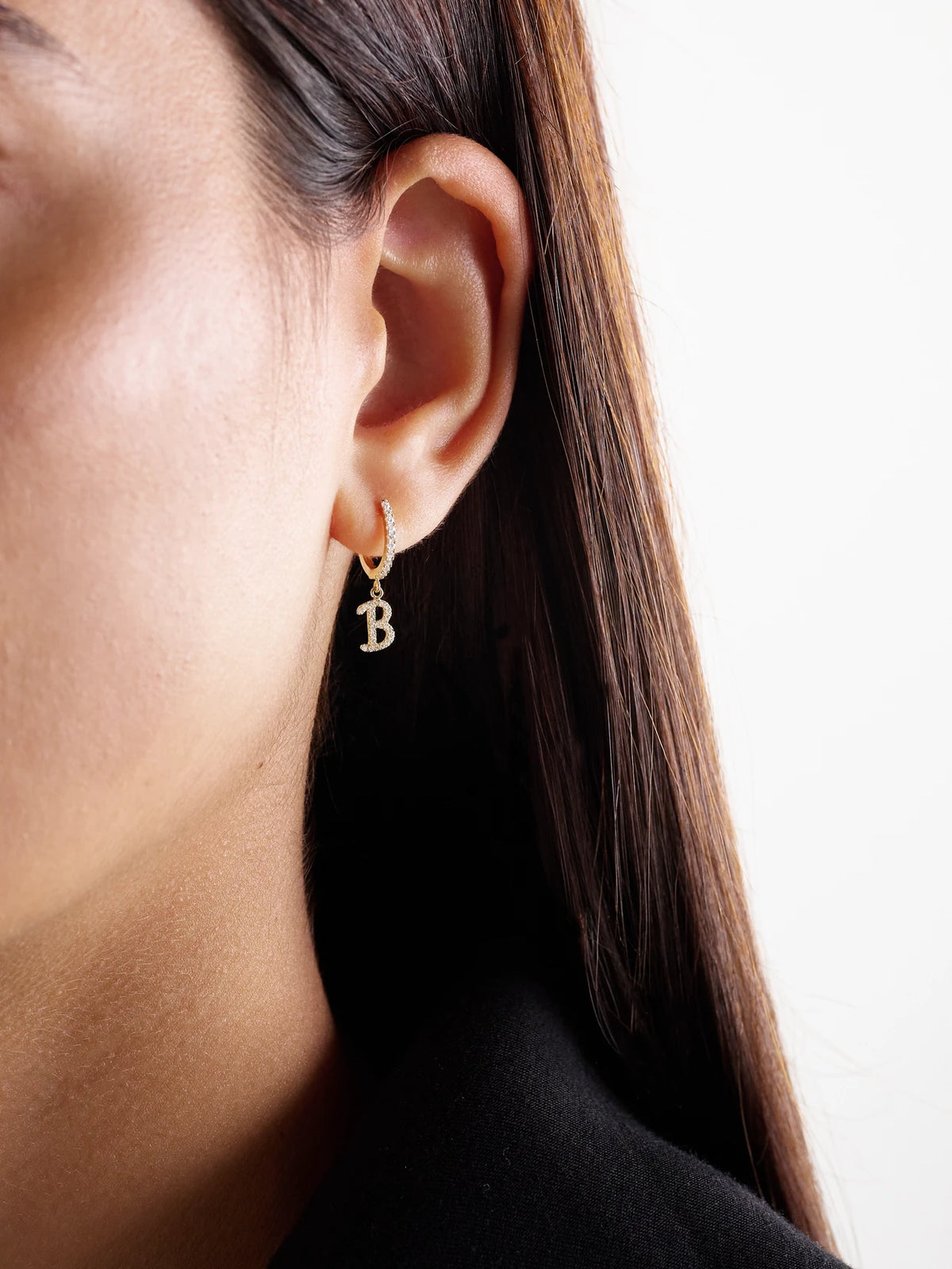 Image of Earrings. Product name - Initial Huggie 18-karat Gold Diamond Single Earring in A colour by brand - Anita Ko